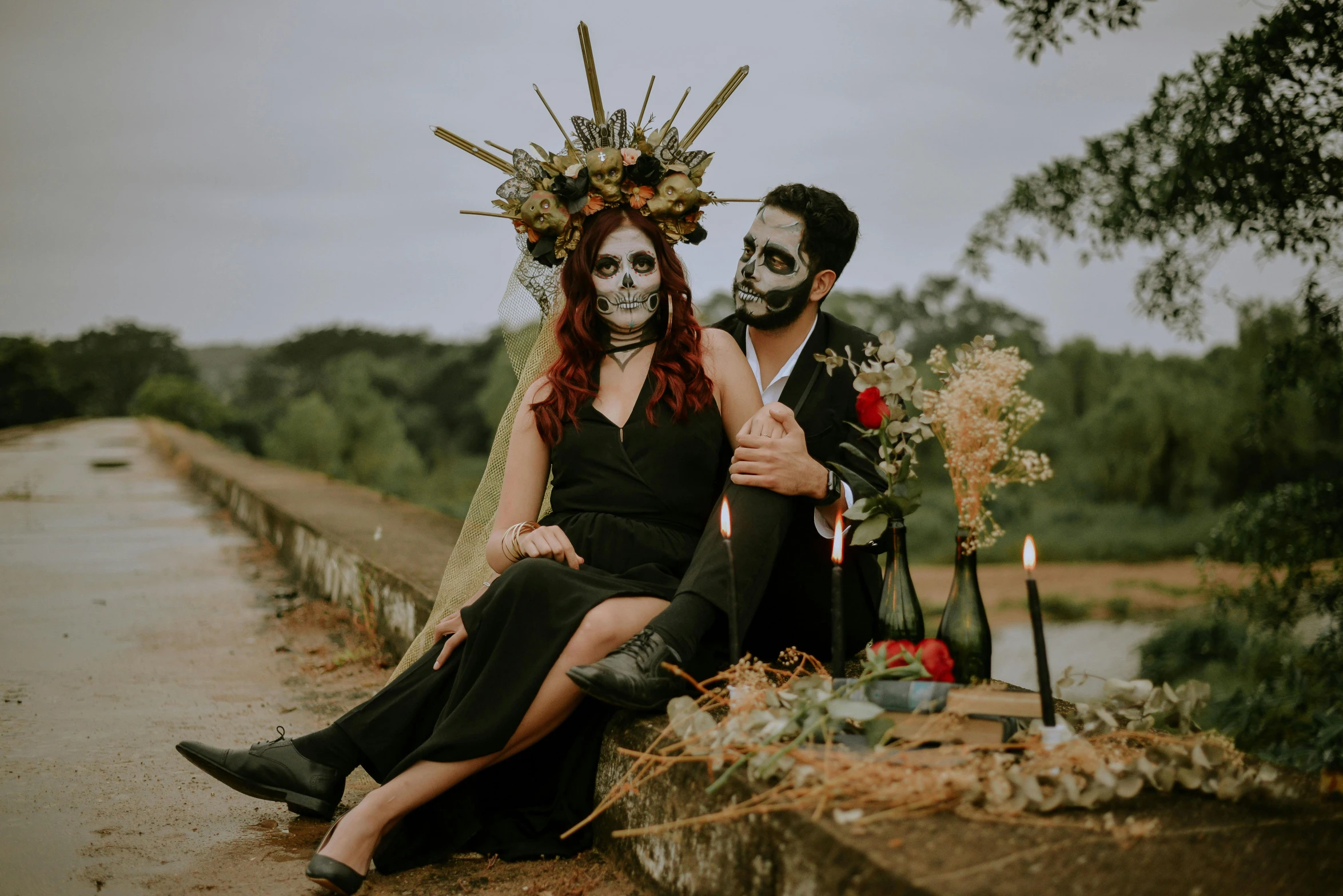 a man and woman sitting next to each other on a bridge, an album cover, pexels contest winner, international gothic, dia de muertos dress and make up, headpiece headpiece headpiece, on a canva, female death holding a cocktail