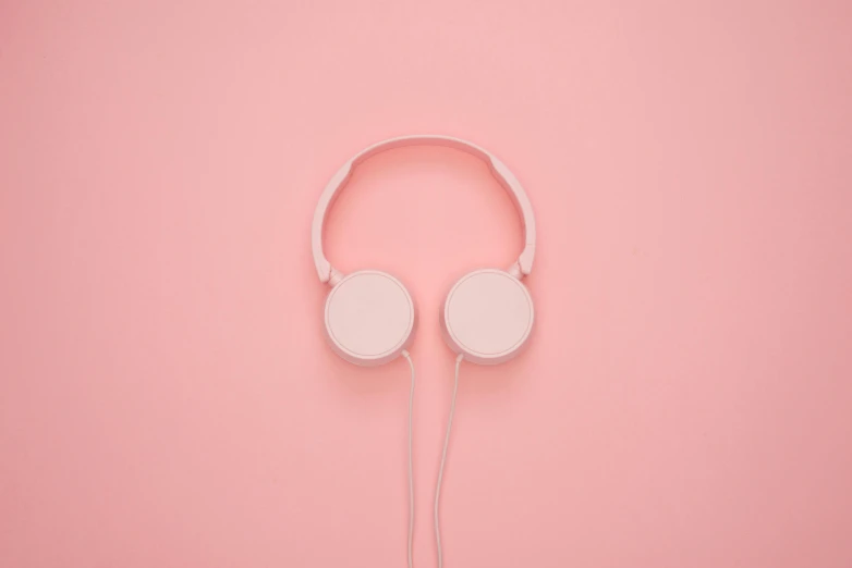 a pair of white headphones on a pink background, by Adam Marczyński, trending on pexels, white noise, instagram picture, single color, ((pink))