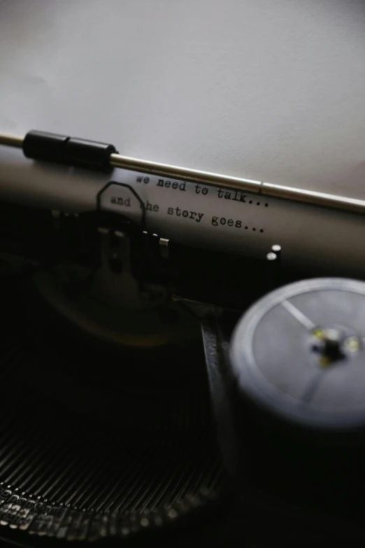 an old typewriter sitting on top of a table, an album cover, by Carey Morris, unsplash, engraved blade, close - up profile, thumbnail, multiple stories