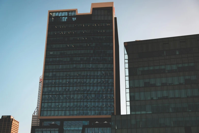 a couple of tall buildings next to each other, a 3D render, pexels contest winner, modernism, realistic establishing shot, freddy mamani silvestre facade, office building, iray shaders