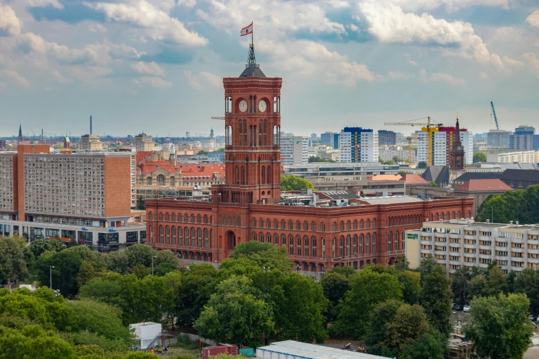 a large building with a clock tower on top of it, pexels contest winner, berlin secession, red castle in background, panorama, aerial, large tall