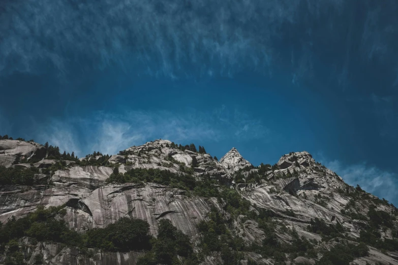 a group of people standing on top of a mountain, an album cover, unsplash, paul barson, clear blue skies, limestone, 4 k hd wallpapear