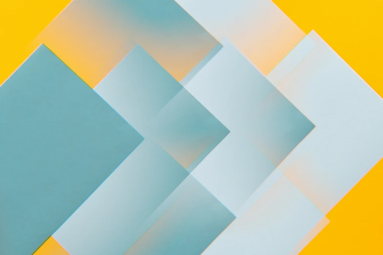 a close up of a piece of paper on a yellow background, pexels contest winner, geometric abstract art, light grey blue and golden, digital art - n 9, zig zag, teal gradient