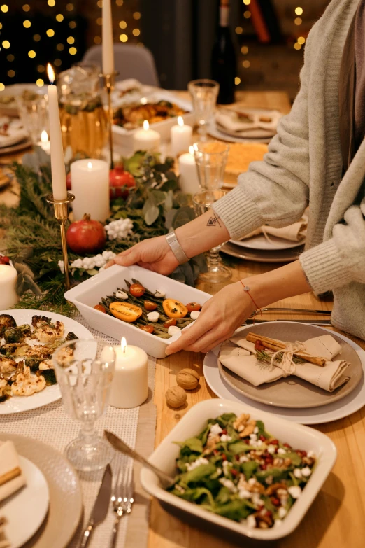 a person sitting at a table with plates of food, holiday vibe, natural candle lighting, profile image, walking down
