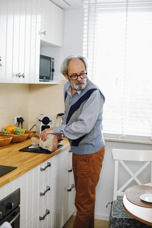 a man standing in a kitchen preparing food, grandfatherly, hide the pain harold, profile image, small