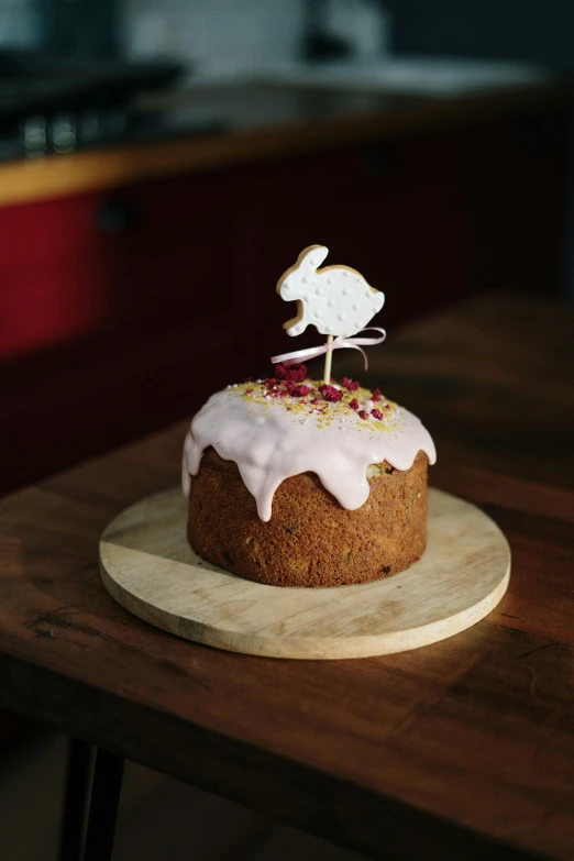 a cake sitting on top of a wooden table, bunny leg, caulfield, festive, medium height