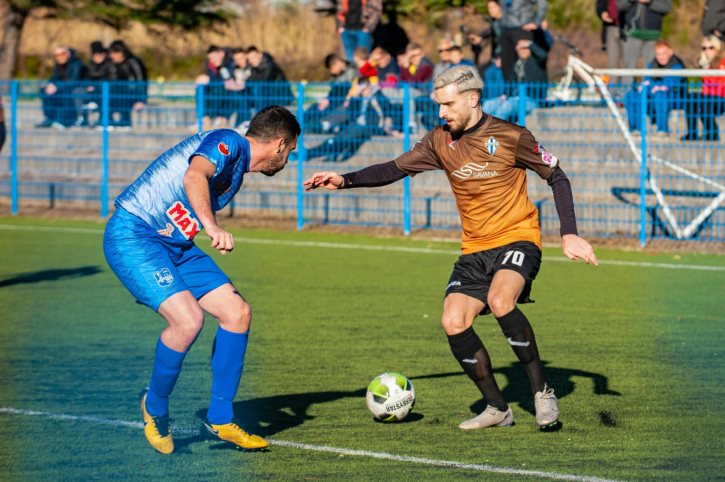 a couple of men playing a game of soccer, a photo, reddit, figuration libre, brown and cyan blue color scheme, szekely bertalan and lotz karoly, square, 8k 50mm iso 10