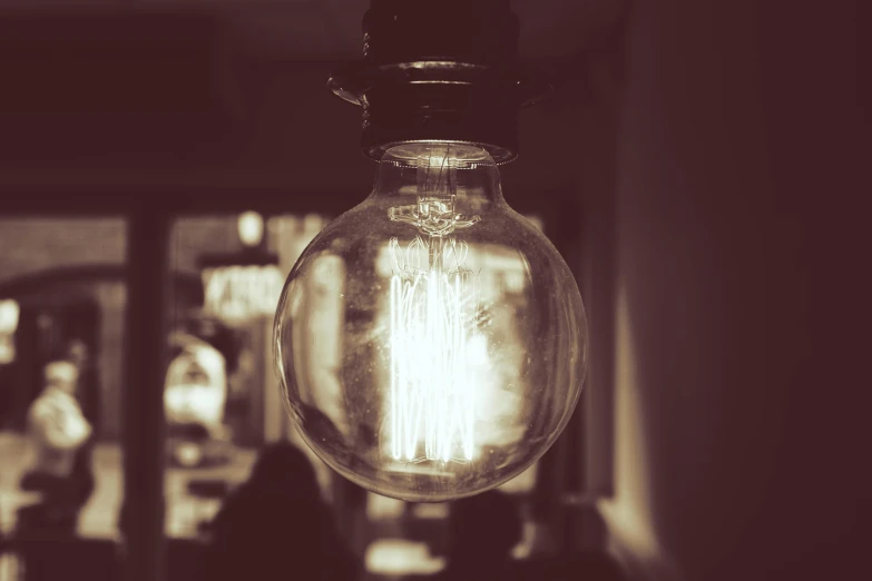 a black and white photo of a light bulb, unsplash, old sepia photography, cafe lighting, neon lamp, instagram photo