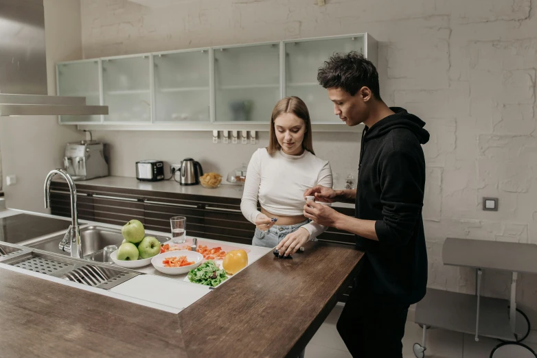 a man and a woman preparing food in a kitchen, pexels contest winner, profile image, fan favorite, pokimane, man grabbing a womans waist