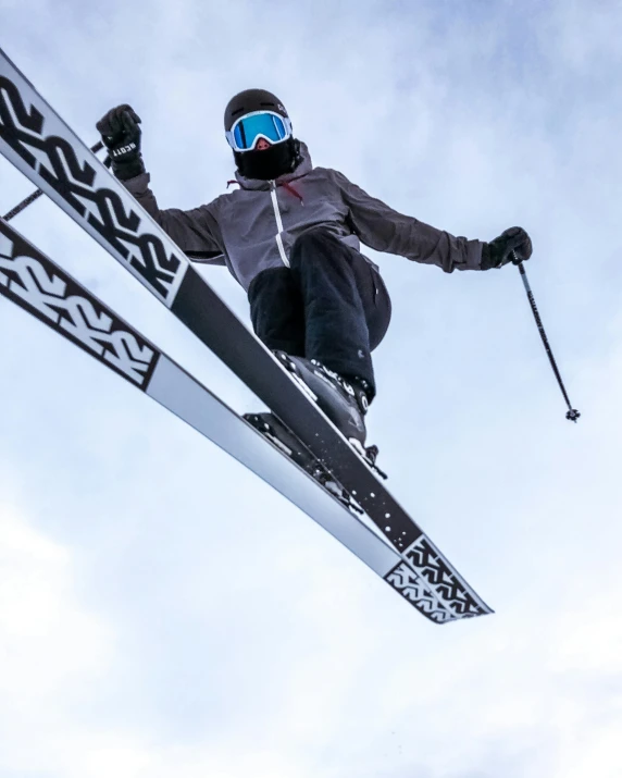 a man flying through the air while riding skis, pexels contest winner, balaclava mask, non-binary, shot from roofline, avatar image