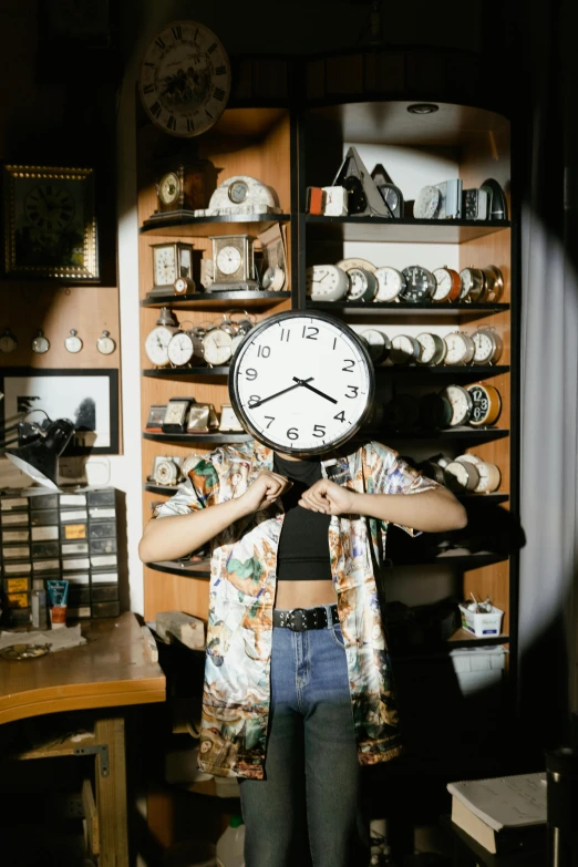 a woman holding a clock in front of her face, an album cover, inspired by Elsa Bleda, trending on pexels, maximalism, in a cluttered lab, apothecary, head to waist, low lighting