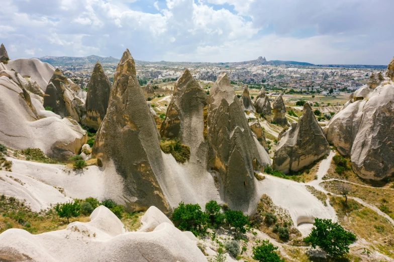 the landscape of cappadin rock formations in cappadin national park, cappadin, pexels contest winner, asymmetrical spires, beige, 90s photo, multiple stories