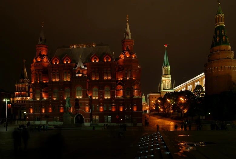 a large building that is lit up at night, by Serhii Vasylkivsky, pexels contest winner, socialist realism, red castle in background, square, 000 — википедия, brown