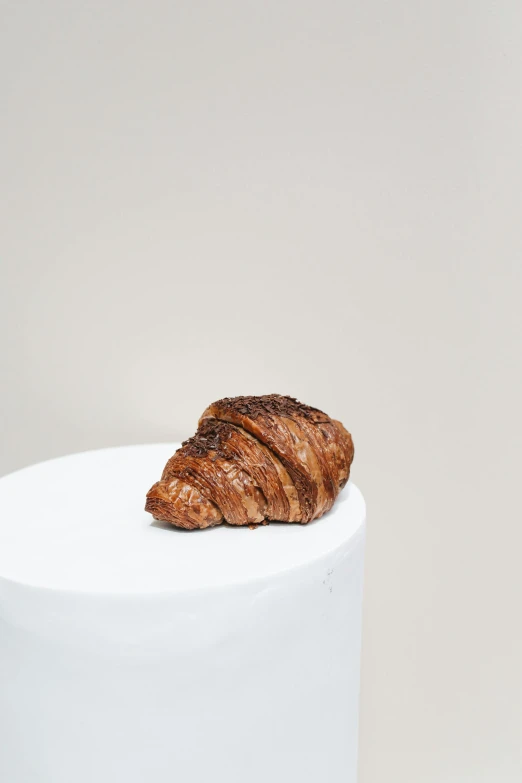 a croissant sitting on top of a white cake, by Gavin Hamilton, 3/4 bust, high grain, seasonal, chocolate