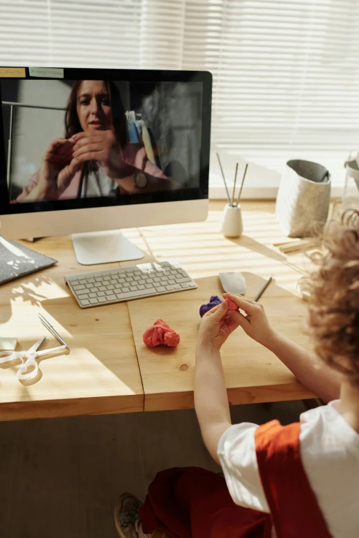 a little boy that is sitting in front of a computer, sculpting, damaged webcam image, promo image, teacher