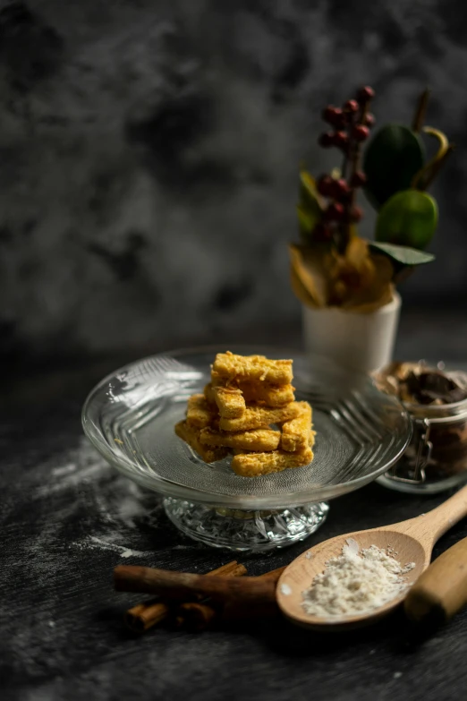 a close up of a plate of food on a table, golden towers, against dark background, onyx, square