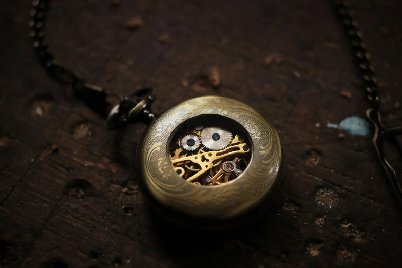 a pocket watch sitting on top of a wooden table, pexels contest winner, assemblage, mechanical detail, brown, medium close shot, hyperdetailed object