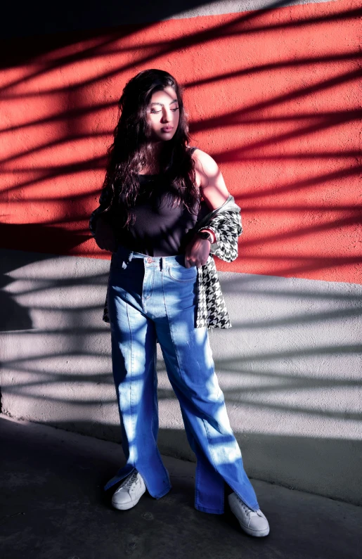 a woman standing in front of a red wall, unsplash, hyperrealism, baggy jeans, sunflare, young asian woman, 90's color photo