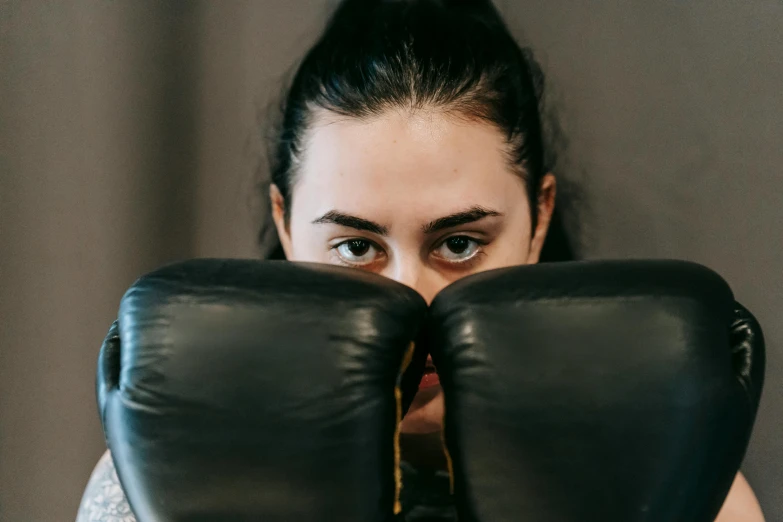 a close up of a person wearing boxing gloves, profile image, charli bowater, upper body image, no watermarks