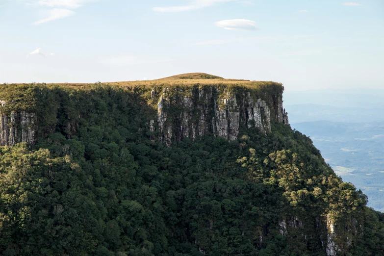 a group of people standing on top of a mountain, te pae, seen from afar, south african coast, julia hetta