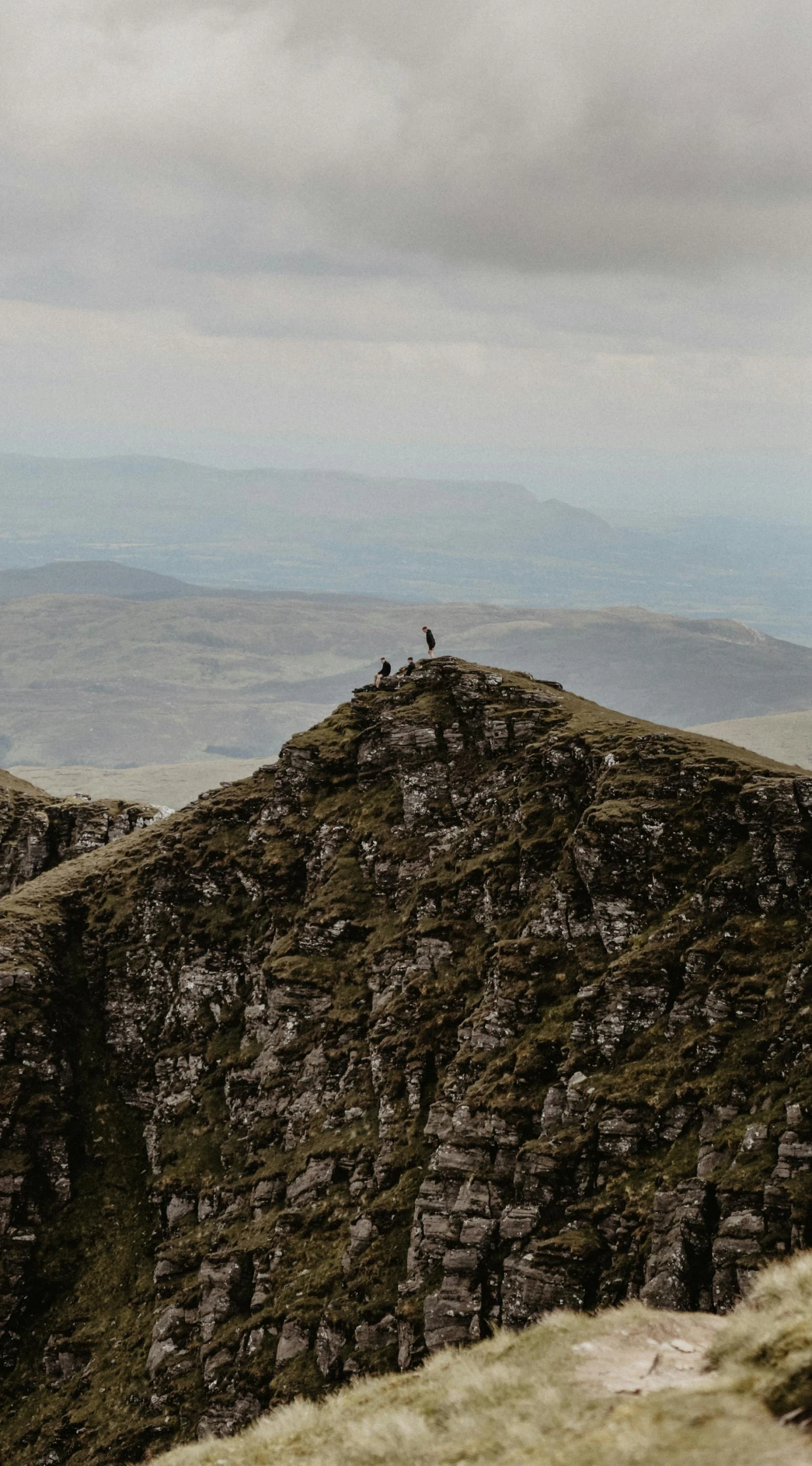 a couple of people standing on top of a mountain, by Bedwyr Williams, les nabis, low quality photo, 8k photo, thumbnail