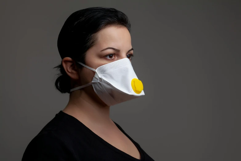 a woman wearing a face mask with an egg on it, inspired by Bela Čikoš Sesija, bag - valve mask, looking to the side off camera, yellow, full lenght view. white plastic