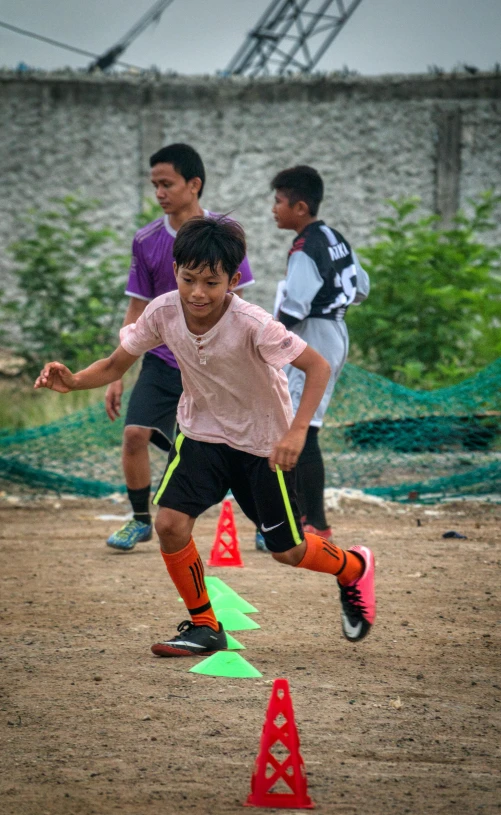 a group of young men playing a game of soccer, dribble, taken with sony alpha 9, low quality photo, happy kid, thumbnail