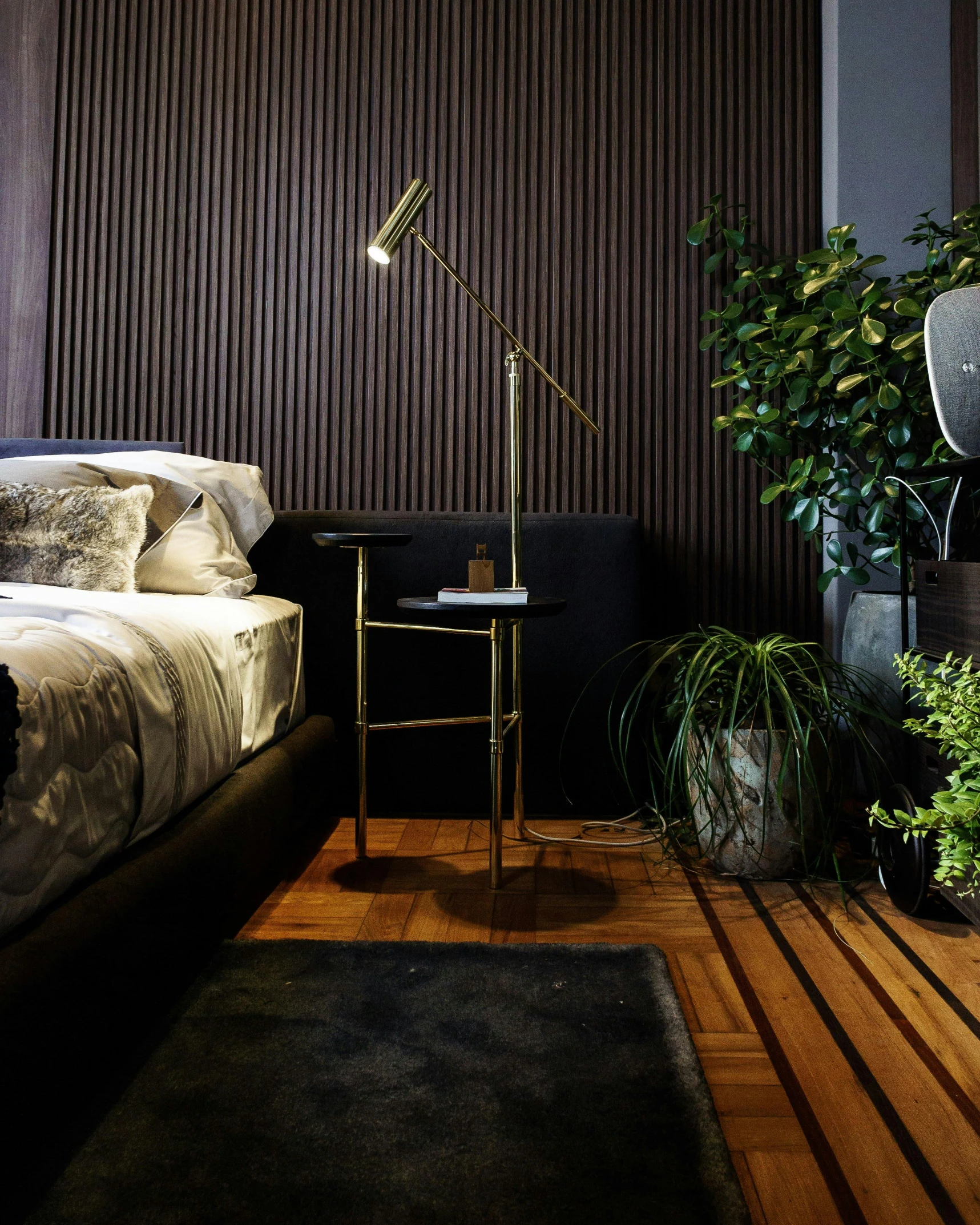 a bed room with a neatly made bed, by Adam Rex, pexels contest winner, modernism, lush plant and magical details, golden dappled dynamic lighting, standing lamp luxury, angled shot