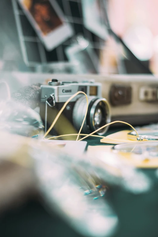 a close up of a camera on a table, by Sven Erixson, unsplash, art photography, revealing wires and electronics, inside of a car, vintage color photo, medium format. soft light