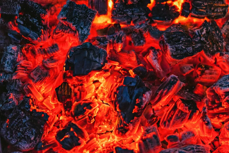a pile of coal sitting on top of a fire, pexels contest winner, red - black, instagram post, background image, outdoor photo