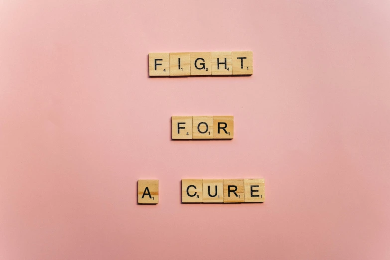 scrabbles spelling fight for a cure on a pink background, by Emma Andijewska, trending on pexels, light skin, sickness, - 12p, natural sunlight