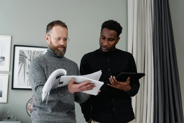 a couple of men standing next to each other, middle of the page, ignant, professional work, looking to the side off camera