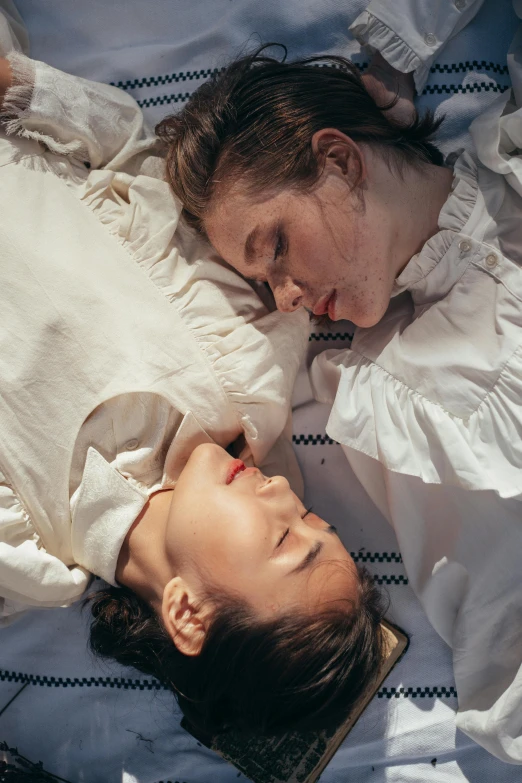 a couple of people laying on top of a bed, by Elsa Bleda, unsplash contest winner, romanticism, portrait of two girls kissing, white shirts, still from a movie, profile image