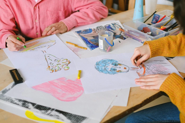 a couple of people that are sitting at a table, a child's drawing, trending on pexels, arbeitsrat für kunst, fashion designer, art supplies, top down drawing, painting of a woman