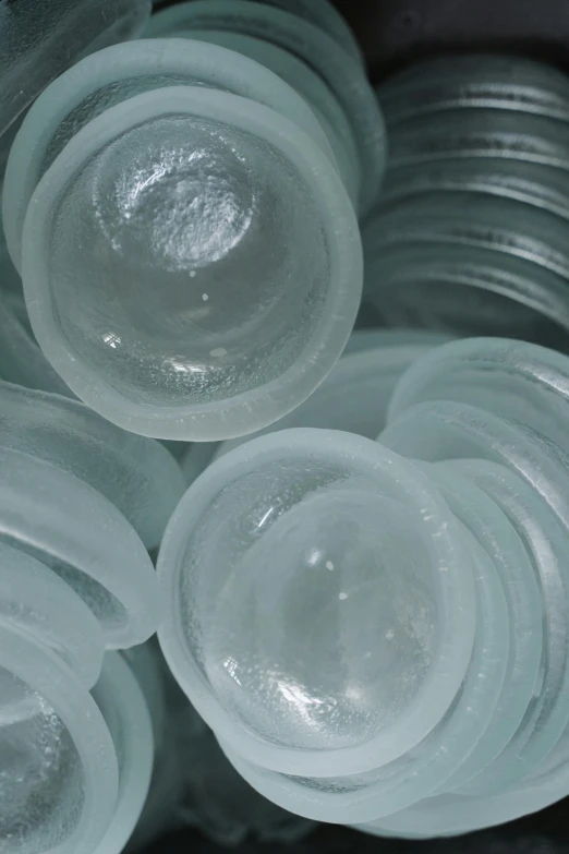 a bunch of plastic cups sitting on top of each other, inspired by Jan Rustem, plasticien, seaglass, medium closeup, soft round features, recessed