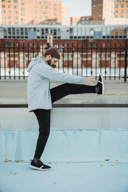 a woman is doing a trick on a skateboard, pexels contest winner, arabesque, athletic tall handsome guys, wearing a grey hooded sweatshirt, pixel stretching, maxim shirkov