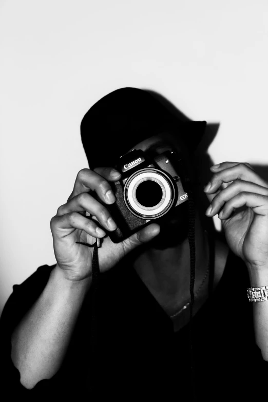a person taking a picture with a camera, a black and white photo, hiphop, ((sharp focus)), profile picture 1024px, hiding