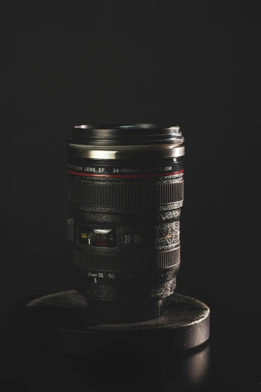 a camera lens sitting on top of a table, by Adam Manyoki, photorealism, on a black background, canon photo, cinematic outfit photo