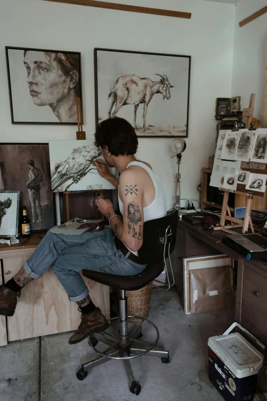 a man sitting on top of a chair in a room, a photorealistic painting, pexels contest winner, inking on skin, artist wearing overalls, mate painting, a photo of a man