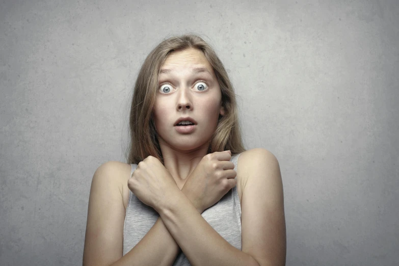 a woman with a surprised look on her face, shutterstock, square, creepy pose, scary stories, shrugging arms