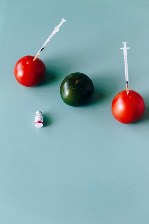 a bunch of tomatoes sitting on top of a table, by Maeda Masao, unsplash, hyperrealism, holding syringe, toys, formulas, third trimester