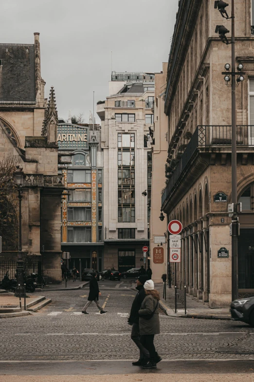 a man riding a skateboard down a street next to tall buildings, a photo, pexels contest winner, paris school, old buildings, square, seen from a distance, a quaint