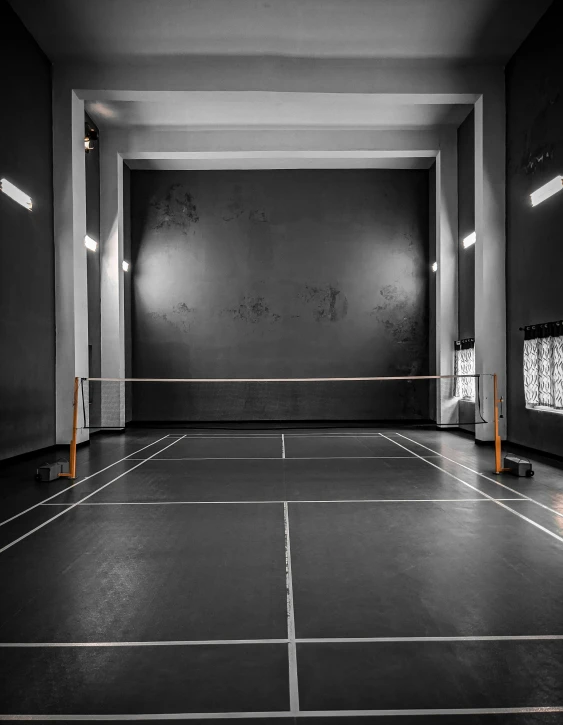 a black and white photo of a tennis court, an album cover, by Matthias Stom, unsplash contest winner, light and space, in a gym, badminton, 15081959 21121991 01012000 4k, theater