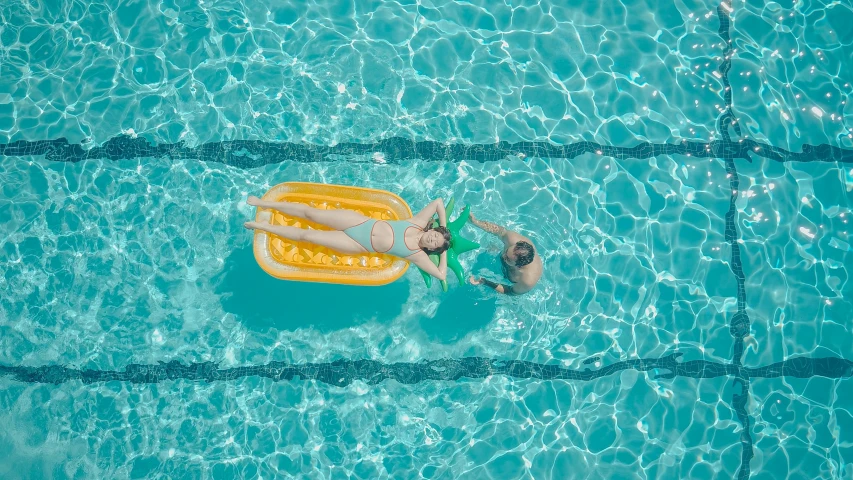 a man floating on an inflatable raft in a pool, by Carey Morris, pexels contest winner, 2 people, alana fletcher, air shot, ilustration