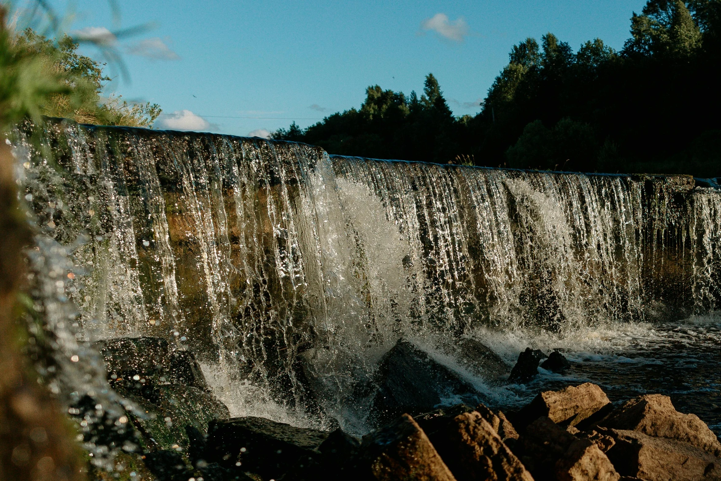 a man riding a surfboard on top of a waterfall, an album cover, unsplash, hurufiyya, espoo, scenic view of river, well preserved, thumbnail