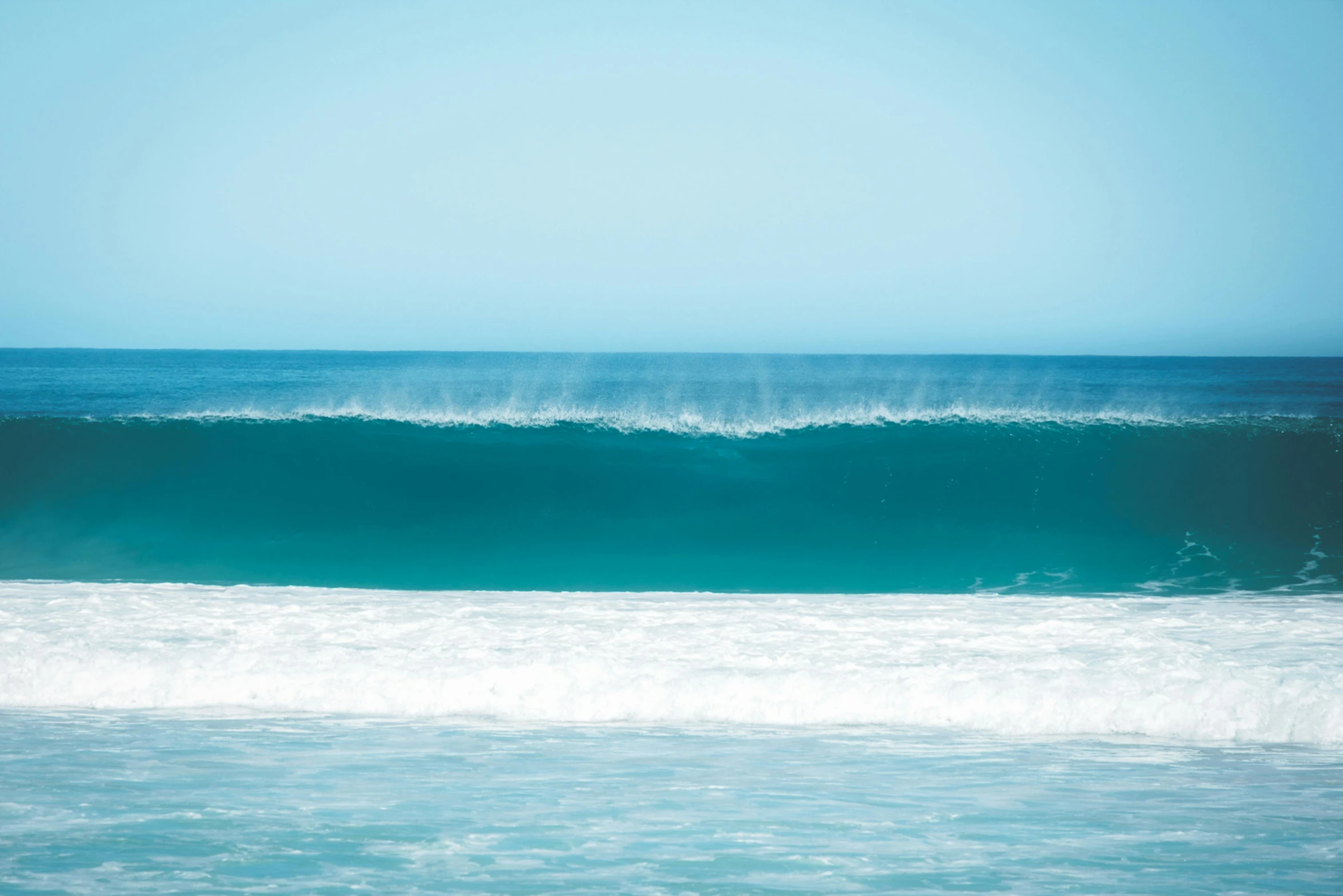 a man riding a wave on top of a surfboard, pexels contest winner, minimalism, turquoise, australian beach, lined up horizontally, magnetic waves