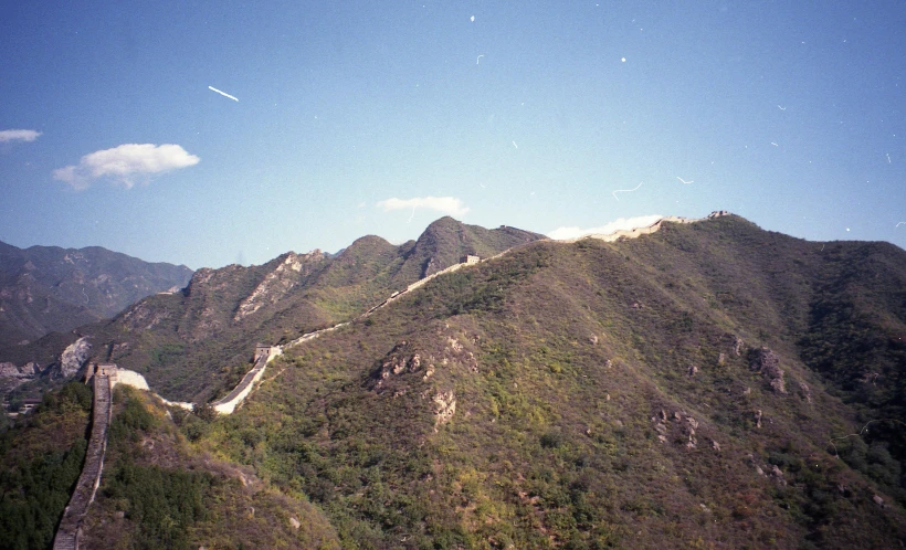 a view of a section of the great wall of china, an album cover, pexels, sōsaku hanga, vhs colour photography, 1990s photograph, mountains, 1999 photograph