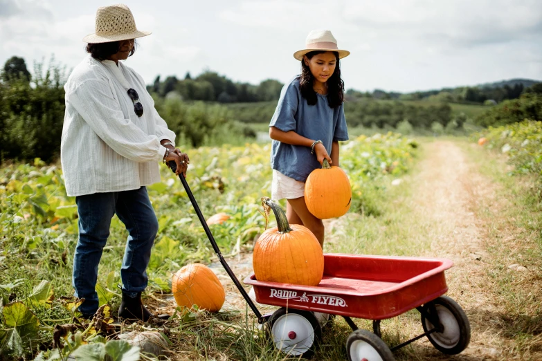 a little girl pulling a wagon full of pumpkins, by Julia Pishtar, essence, alexis franklin, woman, thumbnail