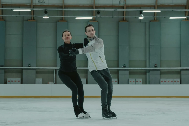 a man and a woman skating on an ice rink, a portrait, pexels contest winner, arabesque, the olympics footage