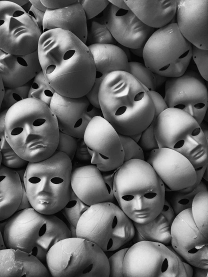 a bunch of masks sitting on top of each other, by David Donaldson, anonymous, blank, by joseph binder, bw